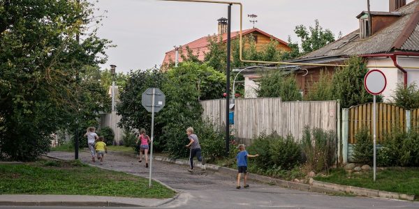 a group of people walking down a street